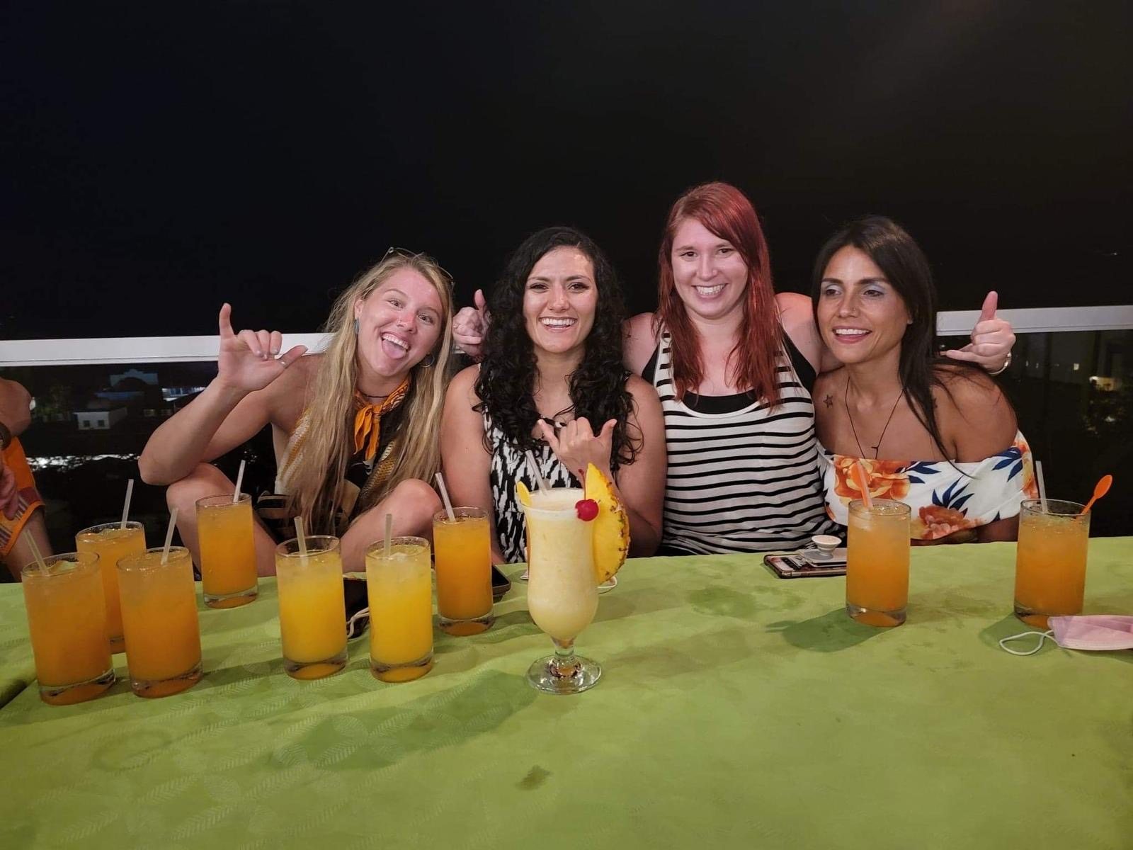 Friends smiling together over drinks