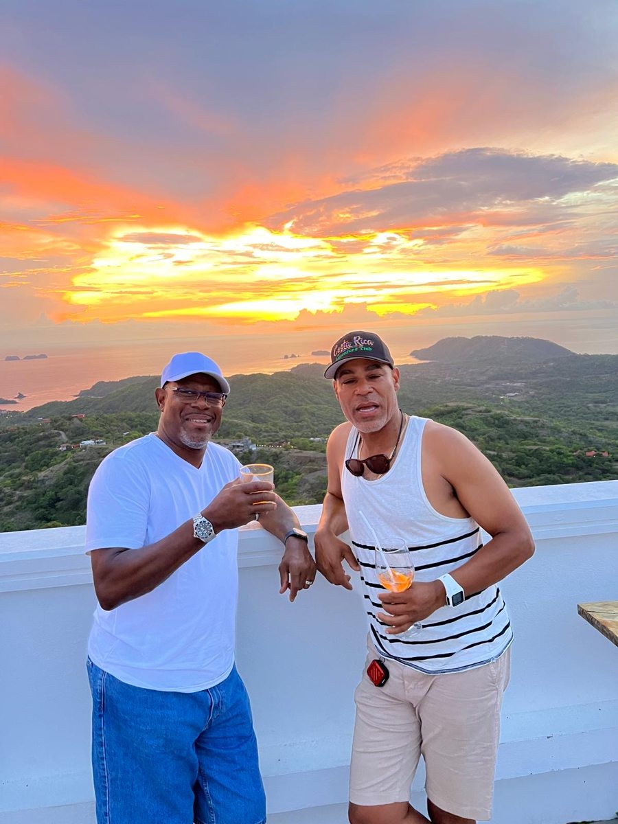 Two friends enjoying a sunset